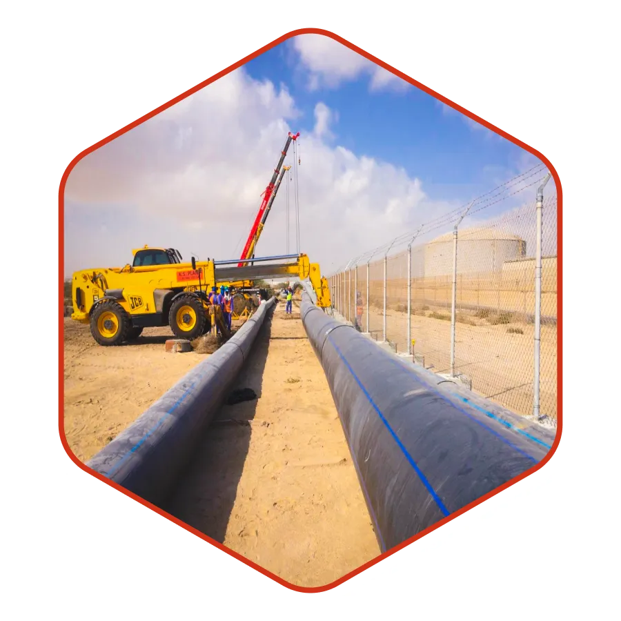 Workers operating machinery for pipeline
